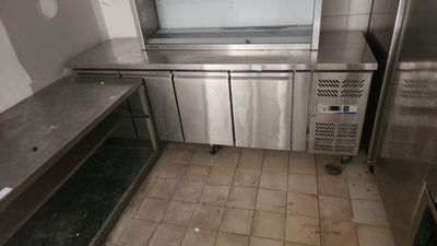 a stainless steel counter top in a commercial kitchen