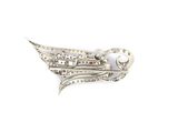 an image of a silver brooch with a bird on it ' s back