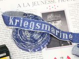 a blue ribbon that says kregskraine on it next to a pair of scissors and a pair of scissors