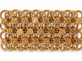 a close up of a gold bracelet on a white background