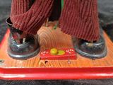 a close up of a toy of a person on a skateboard