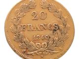 an old french 20 franc coin on a white background