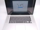 a laptop computer sitting on a table with a world map on the screen