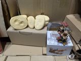 a box with a pair of shoes on it next to a box with a pair of shoes on it