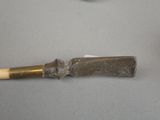 a knife that is laying on a table