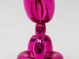 pink balloon dog sculpture on white background with white background