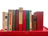 many books that are on a red box