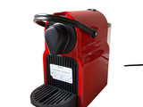 an image of a red coffee machine with a cup of coffee