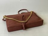 a brown purse with a gold chain hanging from it