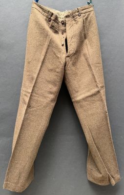 a close up of a pair of pants hanging on a wall