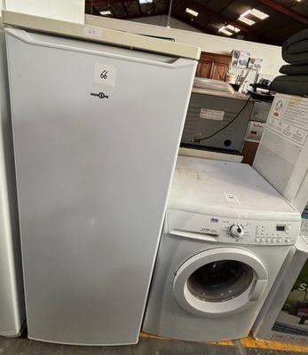 two refrigerators and a washing machine in a store