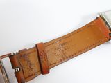 a close up of a belt on a white surface
