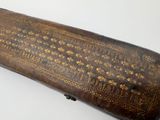 an old wooden case with gold designs on it