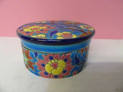 a blue and yellow box with a flower design on it