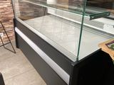 a display case with a glass top in a store
