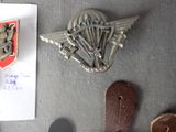 a picture of a badge and some other items on a table
