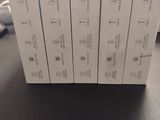 four white boxes are stacked on top of each other on a table