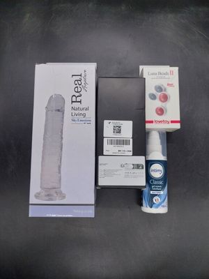 a toothbrush, toothpaste, toothpaste, and a box of toothpaste on a table