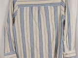 a white and blue striped shirt hanging on a hanger