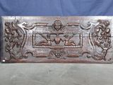 an old wooden box with carvings on it sitting on a table