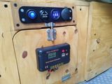 a close up of a control panel with a clock on it