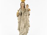 a statue of a woman with a crown on her head