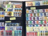 a lot of different stamps on the pages of a book