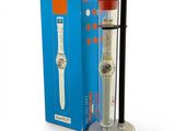 a watch that is sitting on a stand in front of a box