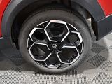 a close up view of a car ' s wheel on the ground