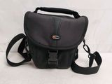 the camera bag is black and has a strap on it
