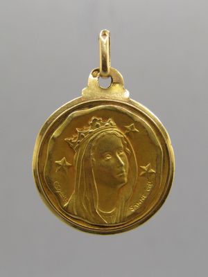 a close up of a gold coin with a woman ' s face on it