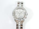 an image of a close up of a wrist watch on a white surface