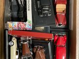 a lot of toy cars in a box on the floor