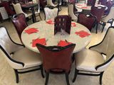 many chairs around a round table in a restaurant