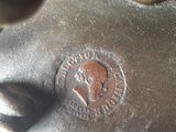 a close up of a bronze statue of a horse