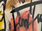 painting of a man with a hat and a name on a wall