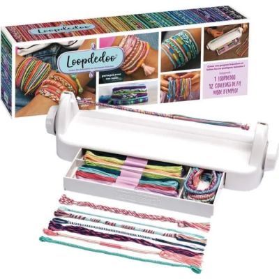 a close up of a roll of yarn next to a box of yarn