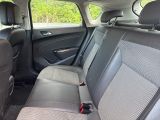 the back seats of a car are empty with no one in it