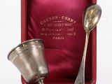 silverware in a red box with a spoon and spoon rest in it