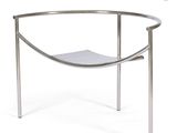 an image of a metal bench with a magazine holder on it