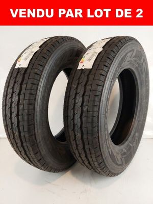 a pair of two tires on a white surface with a red background