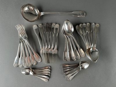 a lot of silver spoons and spoon spoons on a table