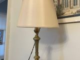 a lamp that is on top of a wooden table