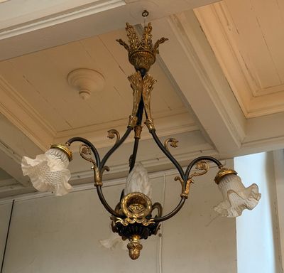a chandelier hanging from the ceiling in a room
