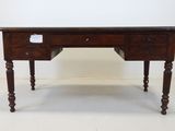 an old wooden desk with two drawers and a drawer underneath it