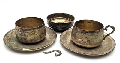 three cups and saucers sitting on a plate