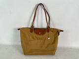 a brown bag sitting on top of a white wall