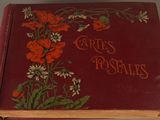 a red book with flowers on it sitting on a table