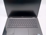 a laptop computer that is sitting on a table