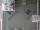 a refrigerator that is wrapped in plastic with a price tag on it